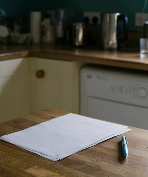 Pen and paper on a kitchen table, ready for an estate planning appointment